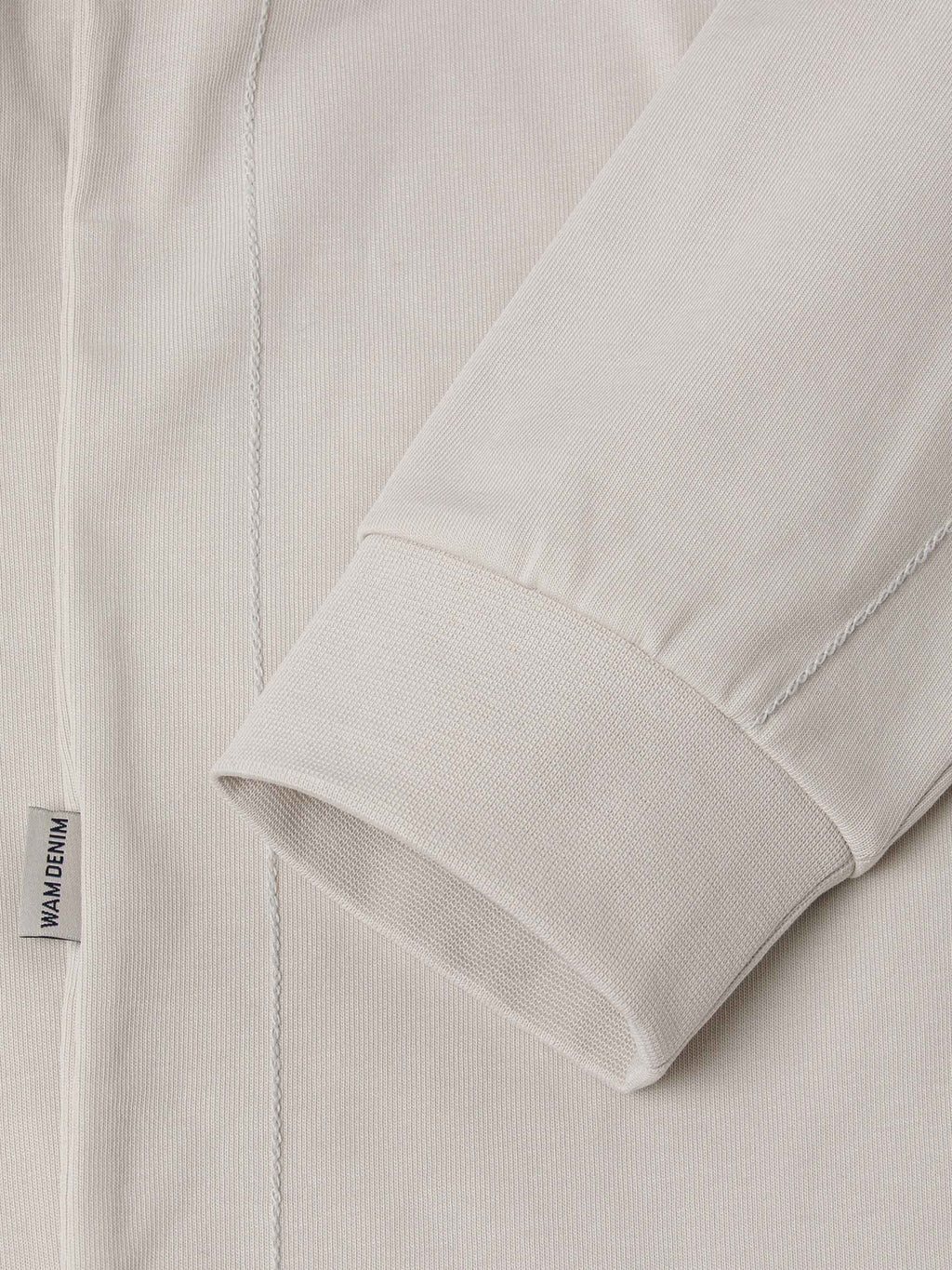 Der hellbeige Pullover „Fervor“