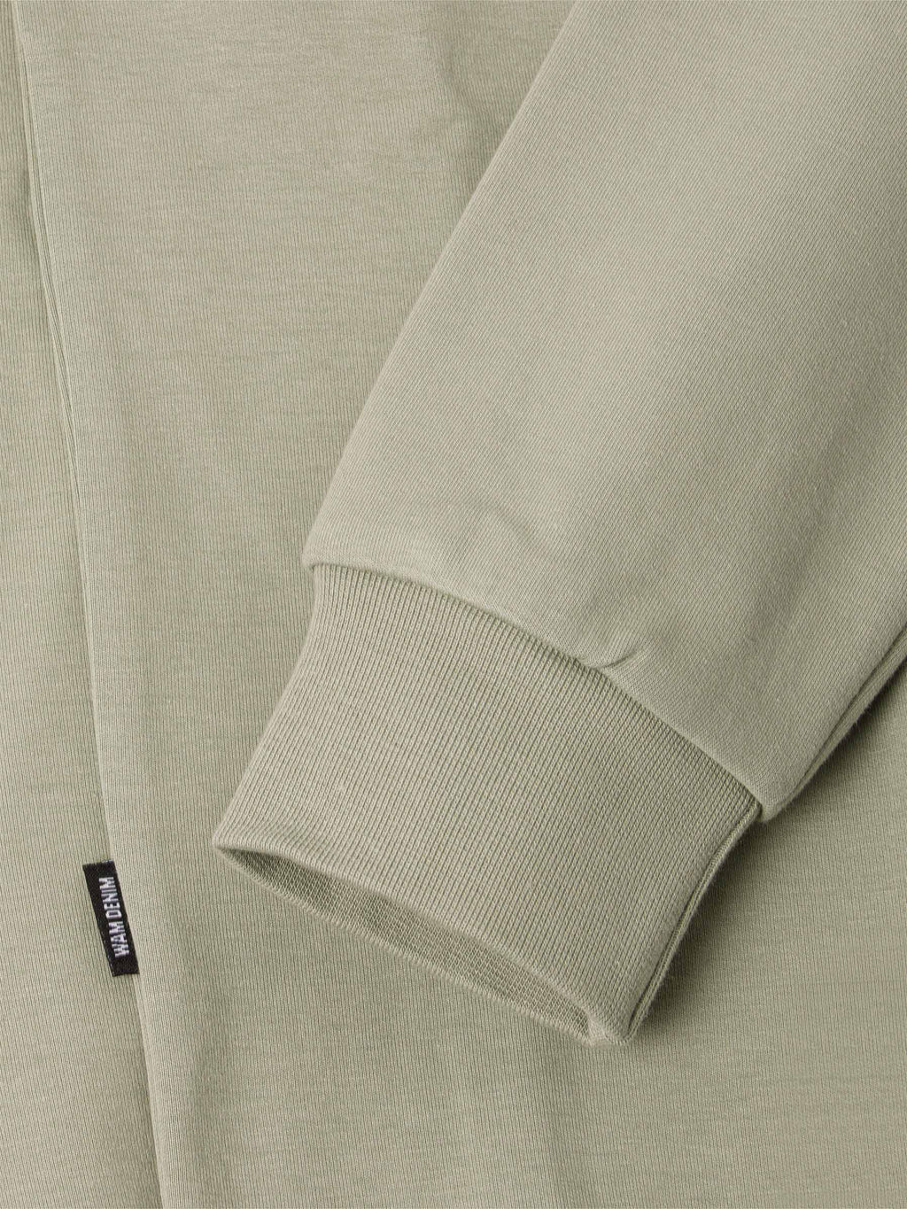 Der hellgrüne Prime-Pullover