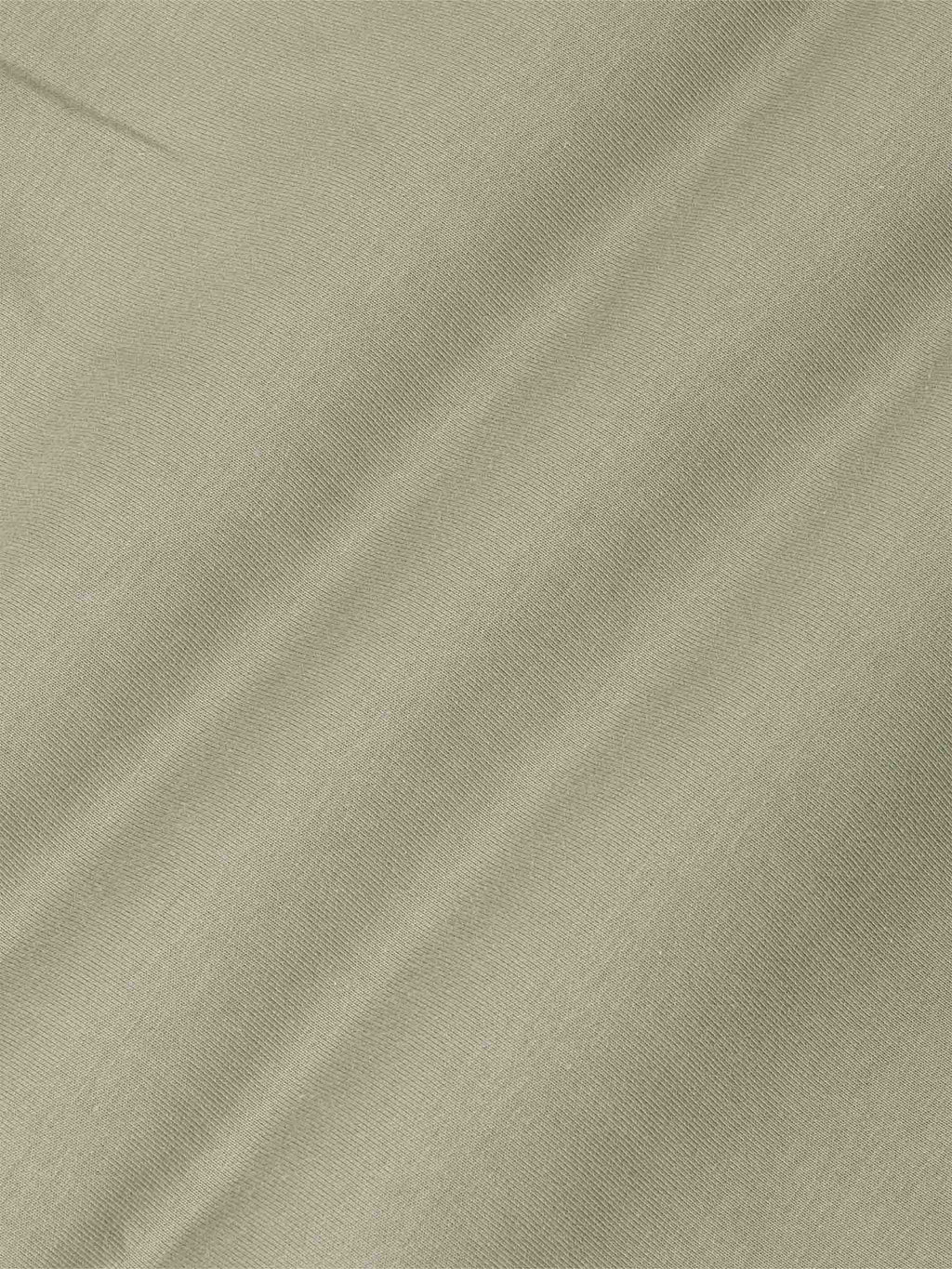 Der hellgrüne Prime-Pullover